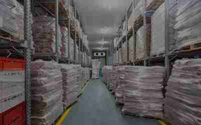A warehouse filled with pallets and boxes.